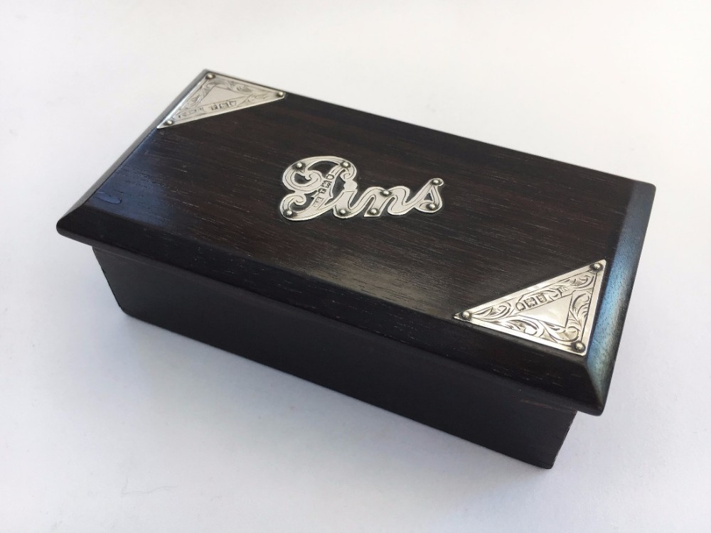 A charming George V ebony and silver pin box