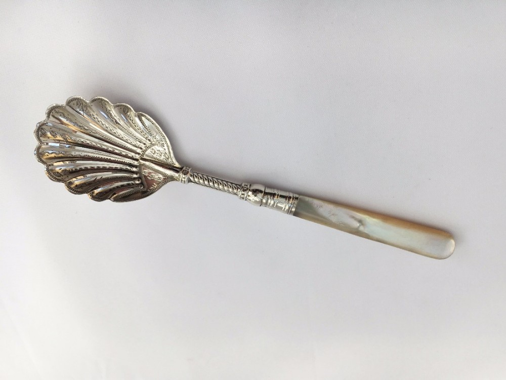 A delightful Victorian silver shell bowl preserve spoon.