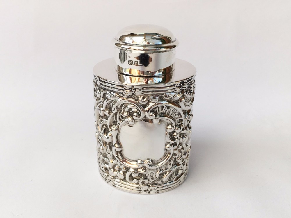 A Edwardian rococo silver tea caddy.