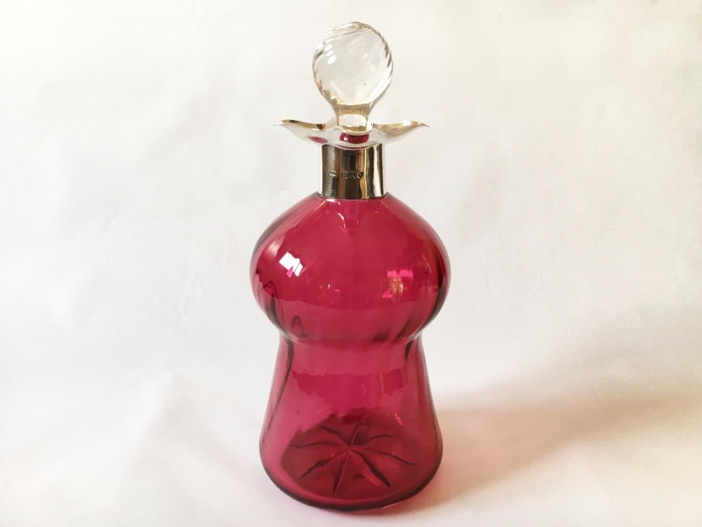A rare and unusual Victorian silver mounted liqueur decanter.