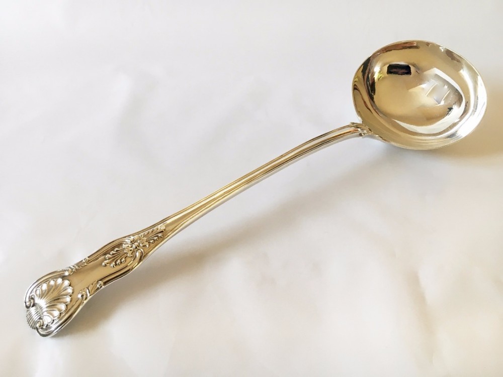 A magnificent William IV Kings pattern silver soup ladle.
