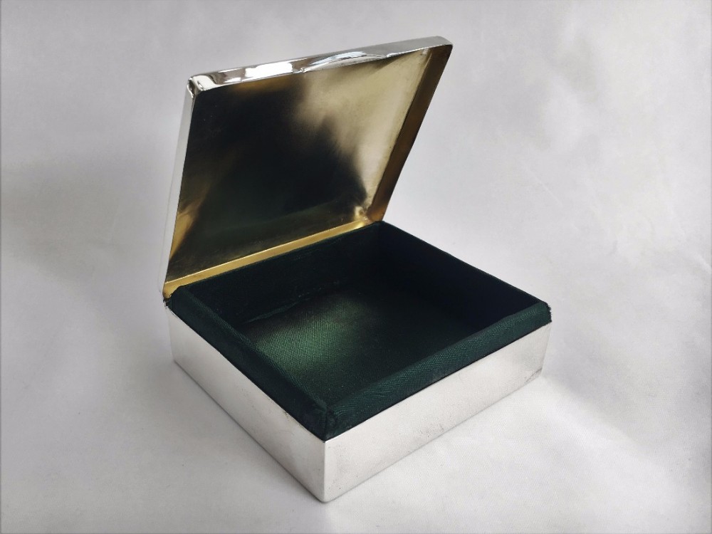 A handsome silver Edwardian green satin lined box.