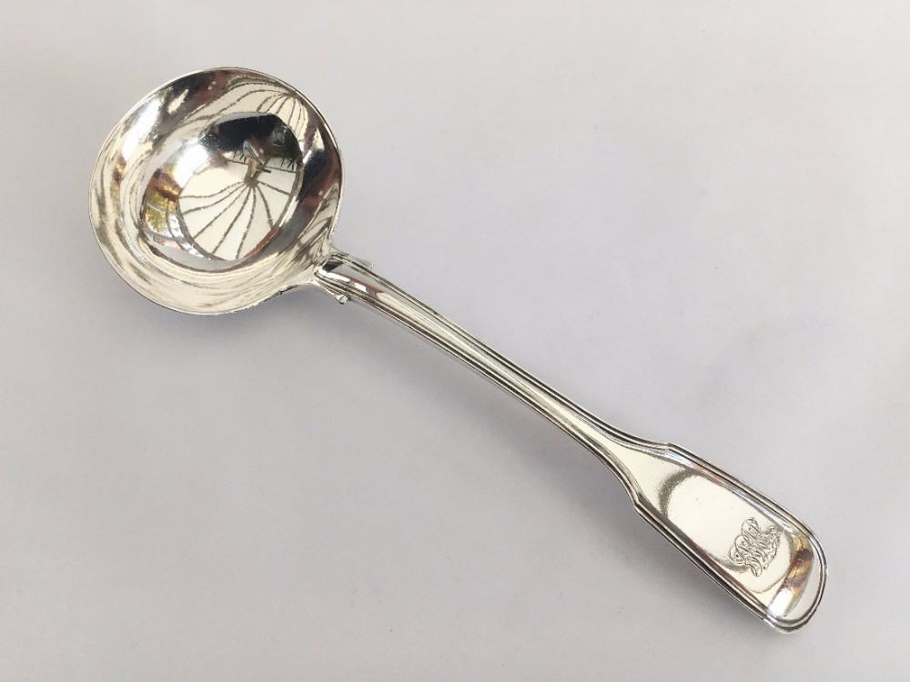 A Victorian silver fiddle & thread gravy ladle.