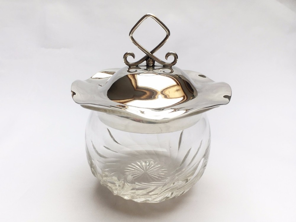 A stylish Edwardian silver lidded preserve jar.
