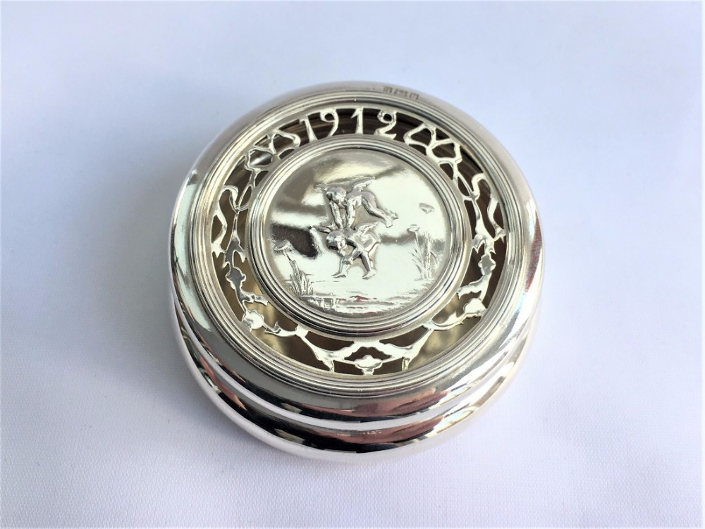 A fabulous pierced silver pot pourri pot.