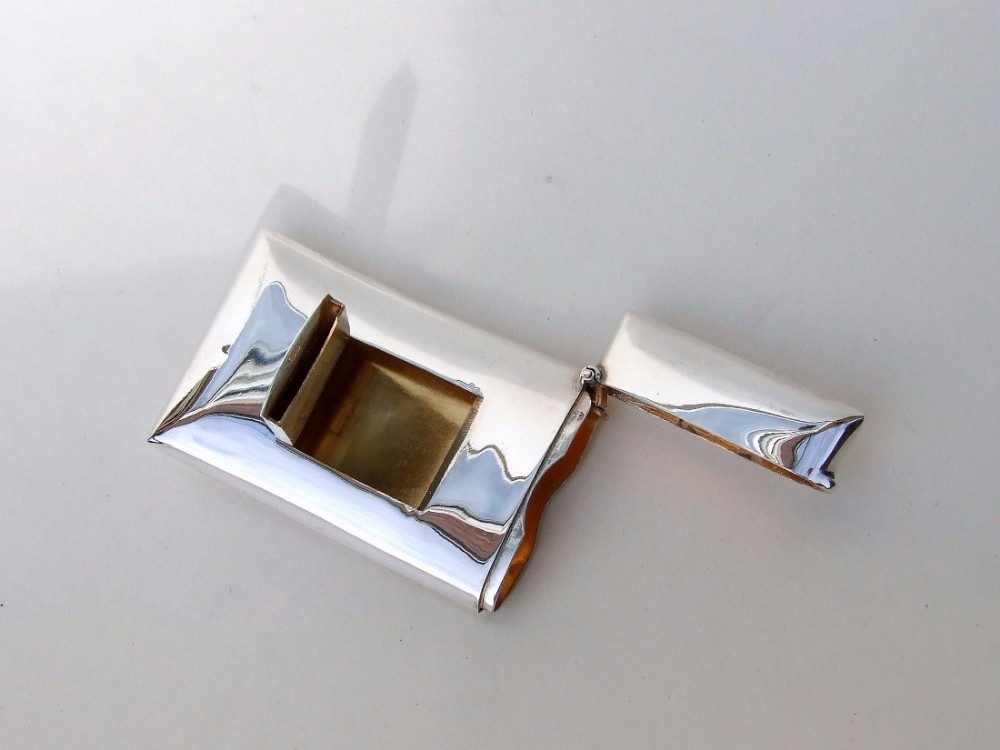 A rare Edwardian silver gilt card and stamp case.