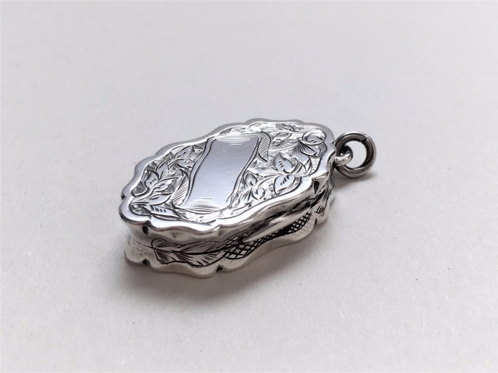 An exquisite miniature Victorian silver vinaigrette.