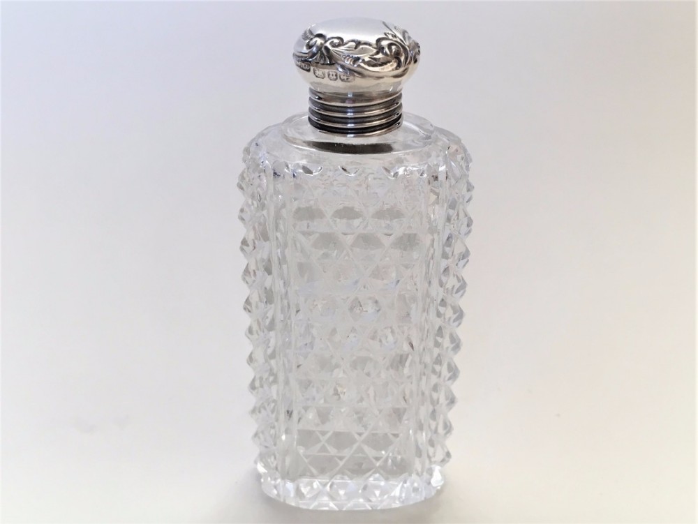 A Victorian cut glass silver mounted perfume.