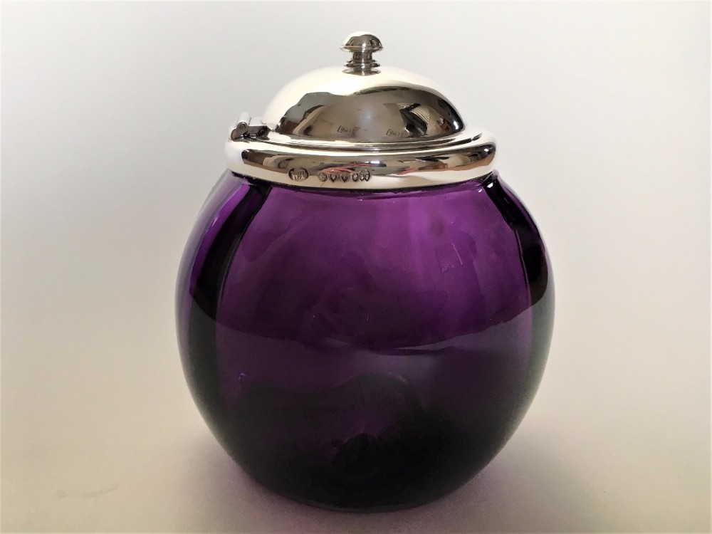 A gorgeous Victorian silver mounted amethyst glass storage jar.