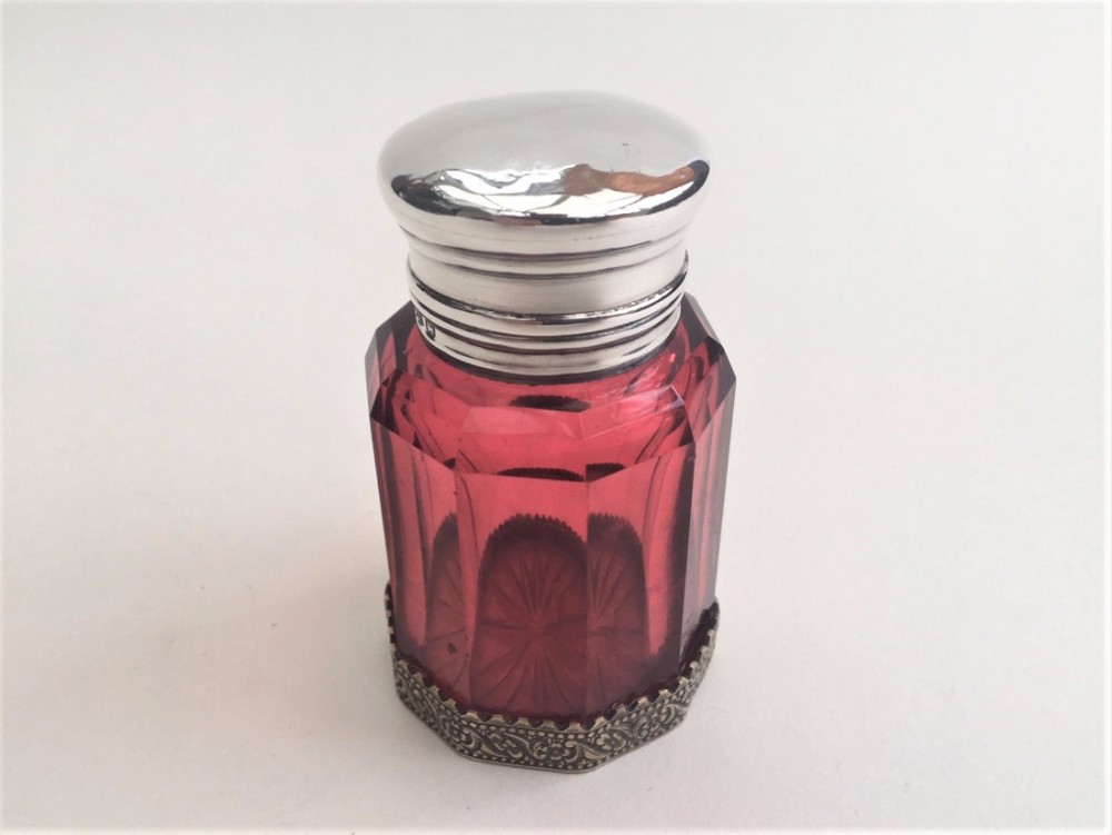 A large silver mounted Victorian cranberry scent bottle.