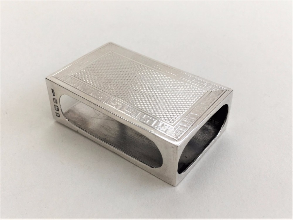 A GEORGE V SILVER MATCHBOX CASE.