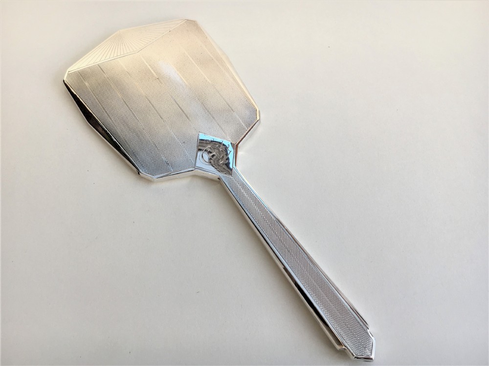 A stylish Art Deco hand mirror from the Chester Assay Office.
