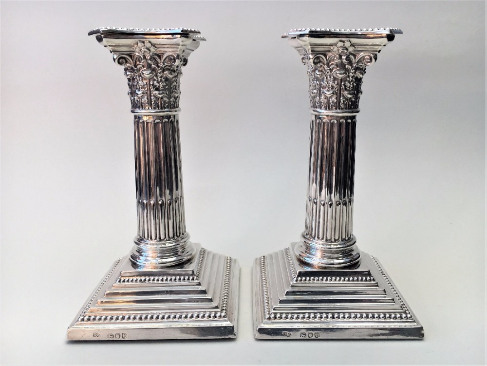 A fabulous pair of Victorian silver Corinthian column candlesticks.