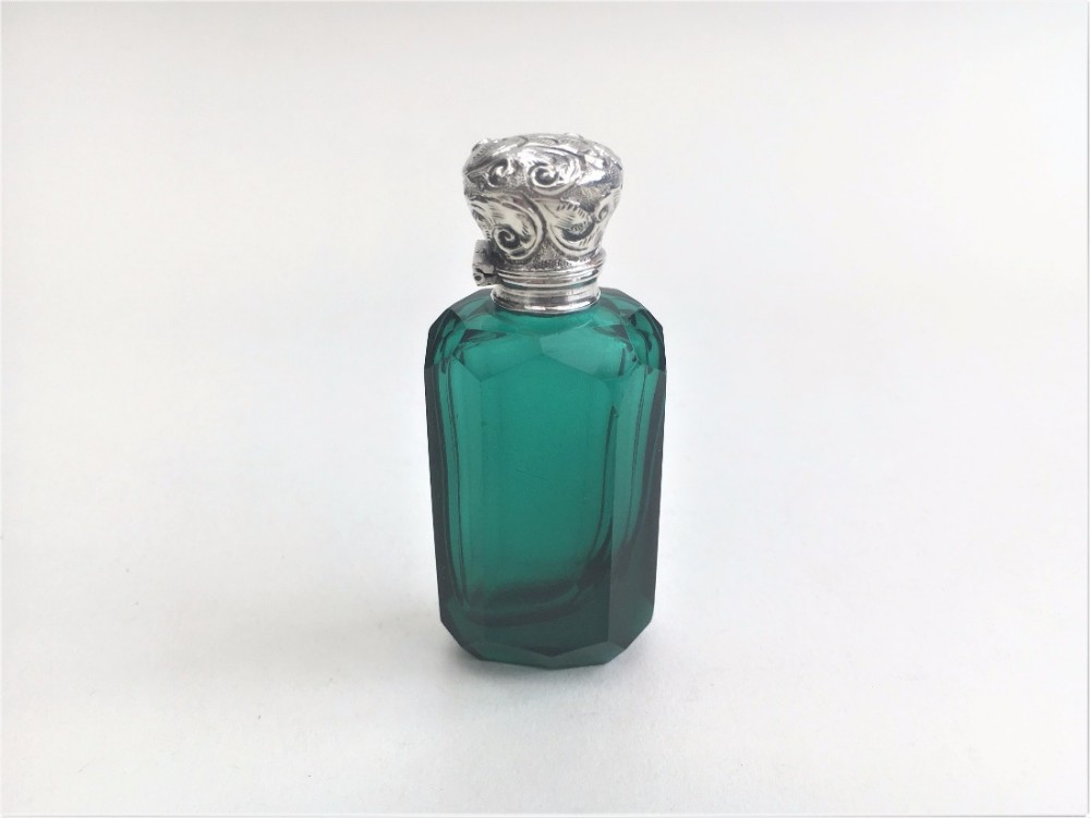 A charming Victorian silver mounted scent bottle.