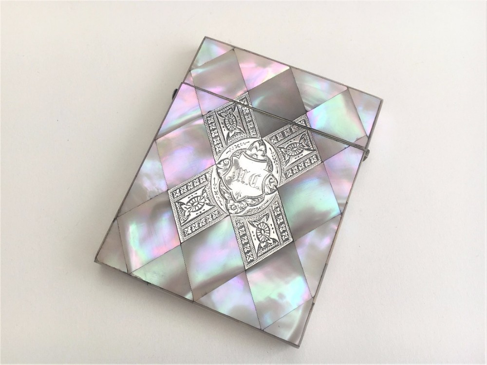 An exquisite Victorian mother of pearl card case with silver inlay.