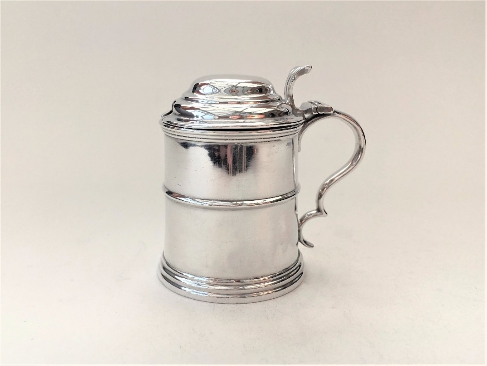 A Victorian silver mustard in Georgian Tankard form.