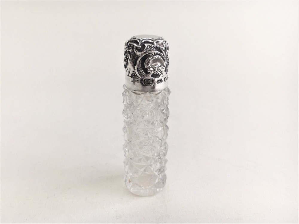 A Victorian silver mounted scent bottle.