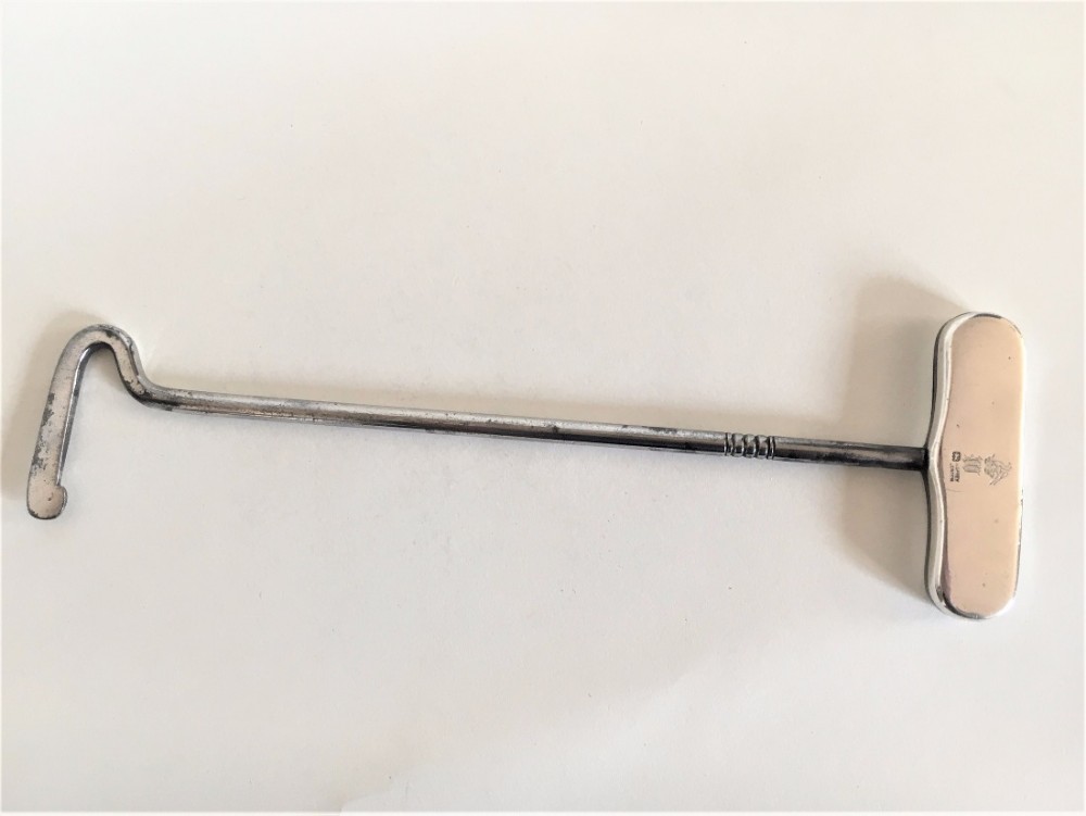 An interesting Asprey silver boot pull.