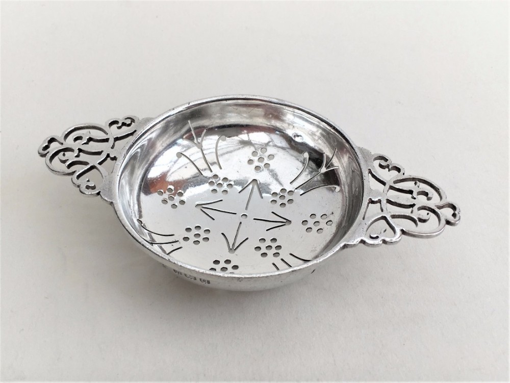 A gorgeous Art Deco period silver tea strainer.