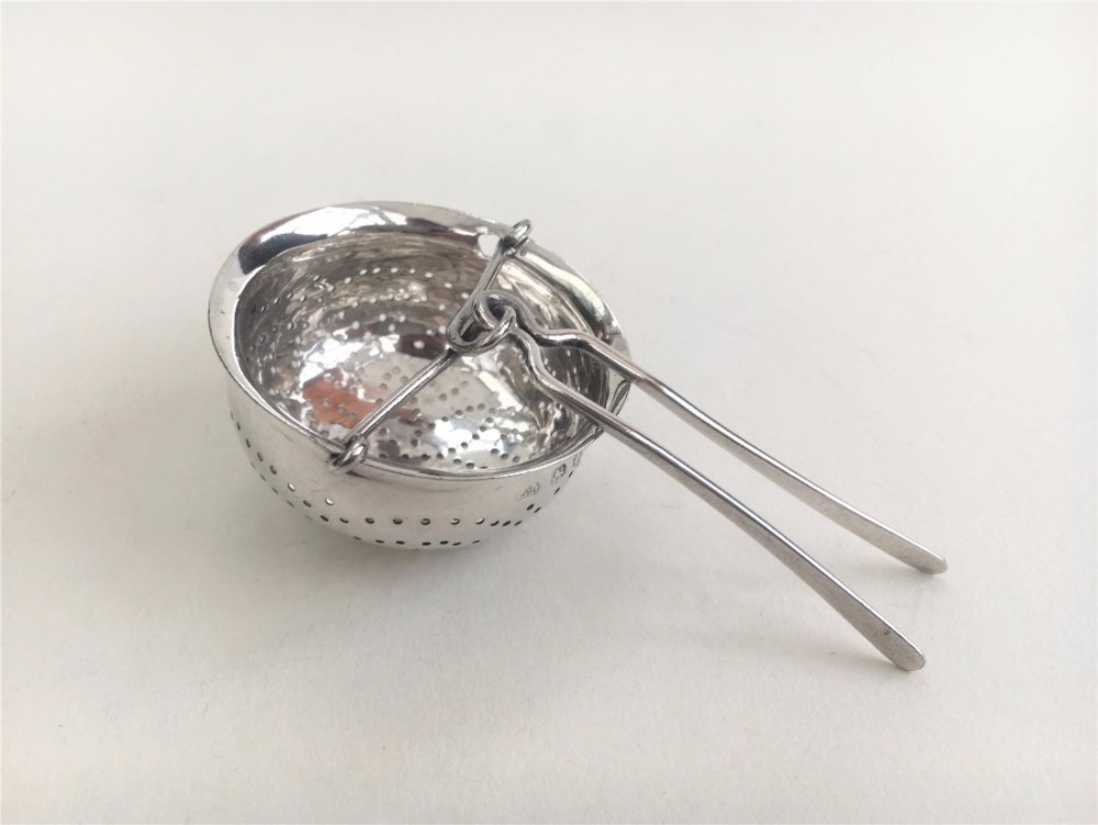 A rare Georgian silver tea strainer.