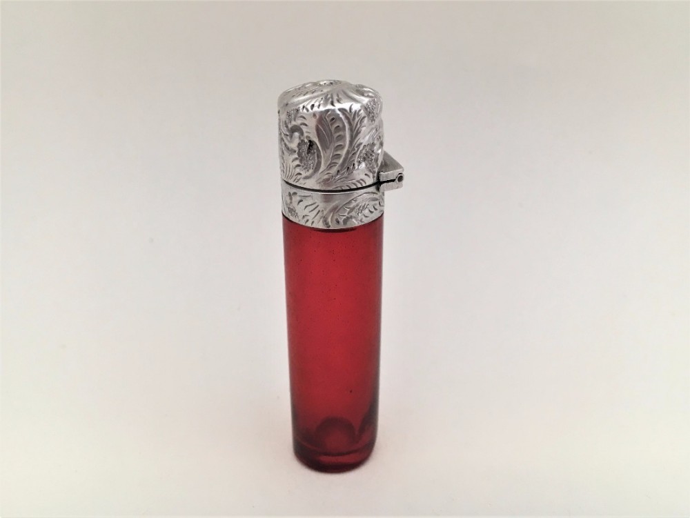 A Victorian silver mounted ruby scent bottle.