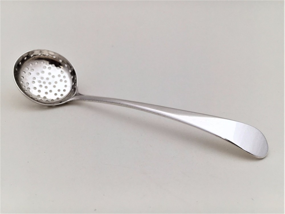 An 18th century silver spice sifting spoon.