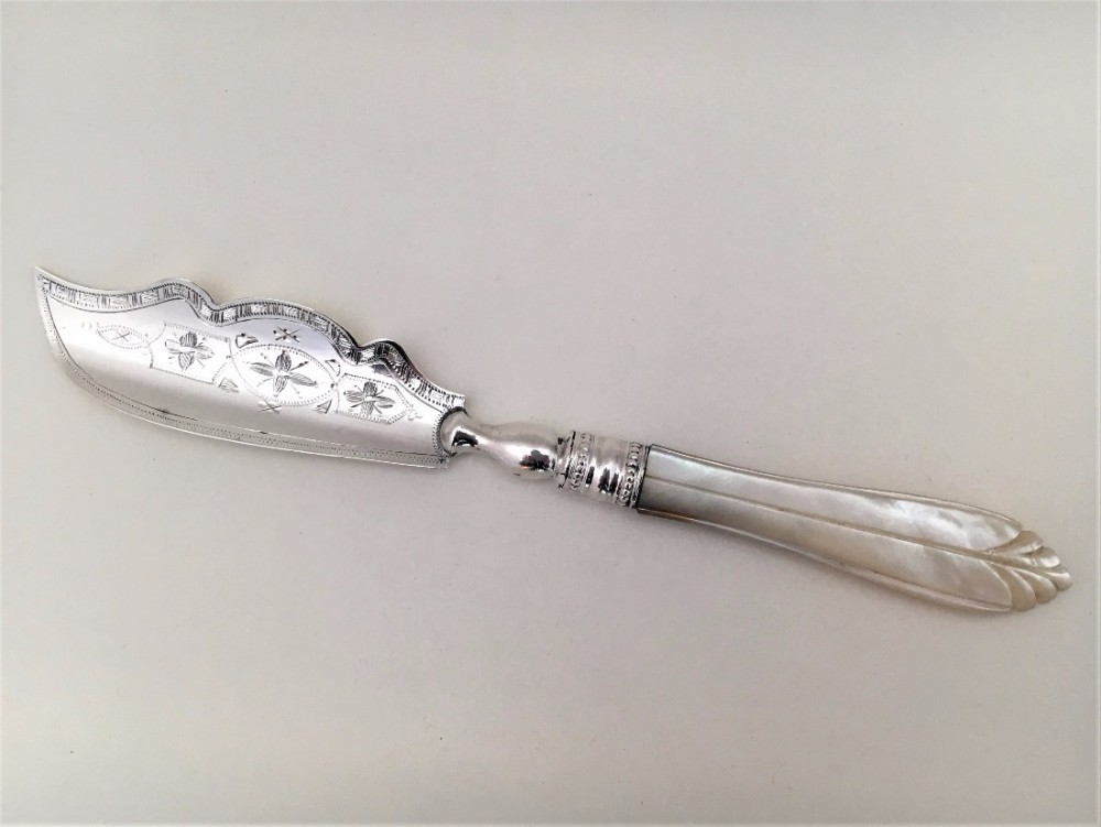 A Charming Victorian silver and mother-of-pearl butter knife.