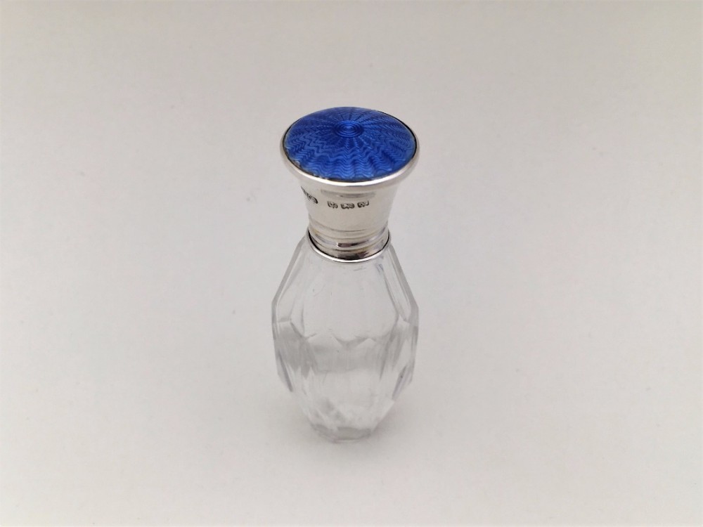 A silver and china blue guilloche enamel scent bottle.