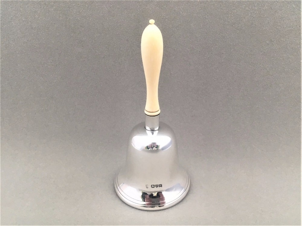 A wonderful George V silver table bell.
