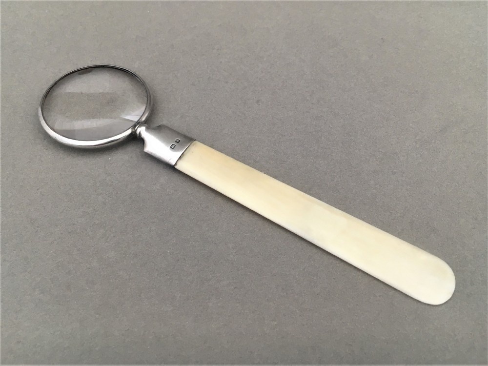 A Silver and Ivory Magnifying letter opener or bookmark.