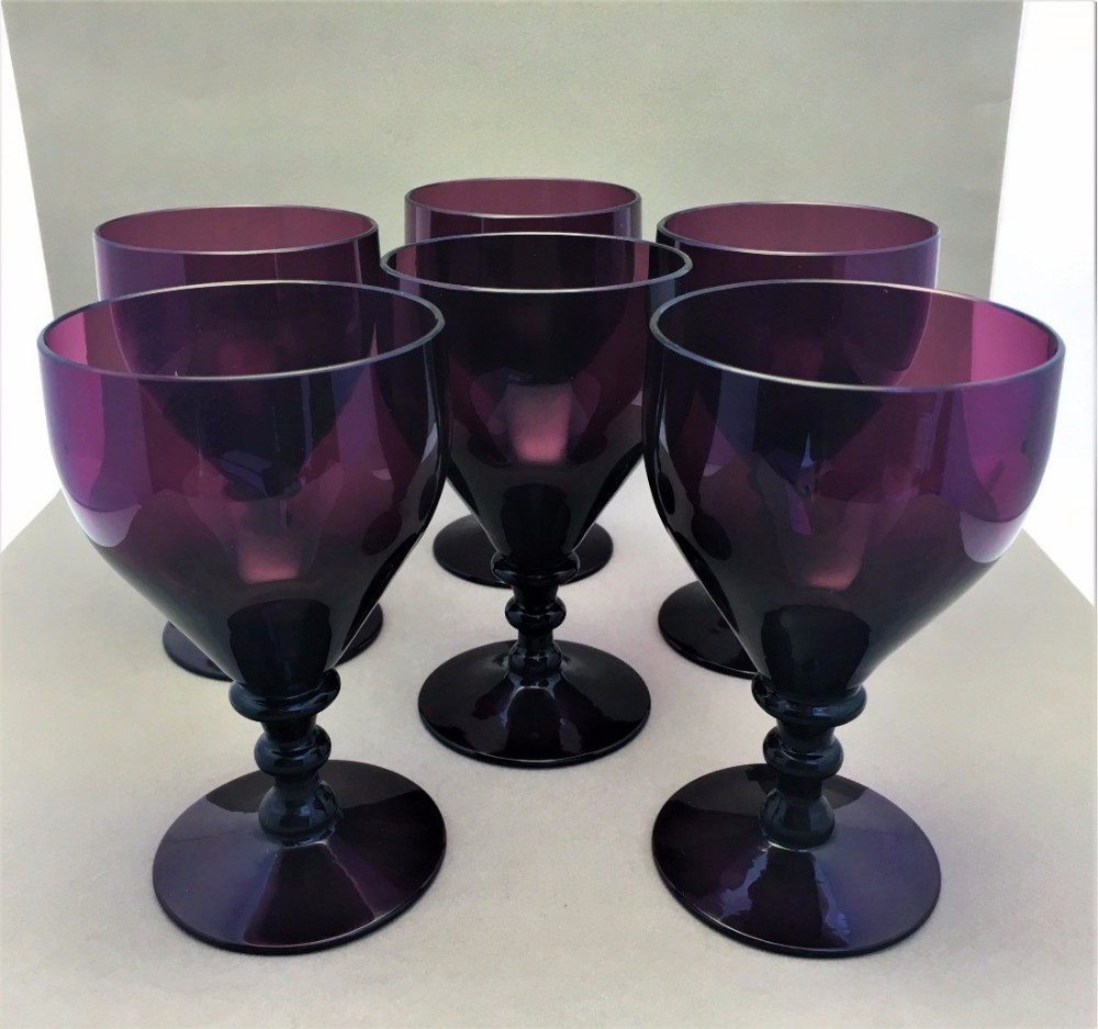 A fabulous set of six Victorian Amethyst wine glasses.