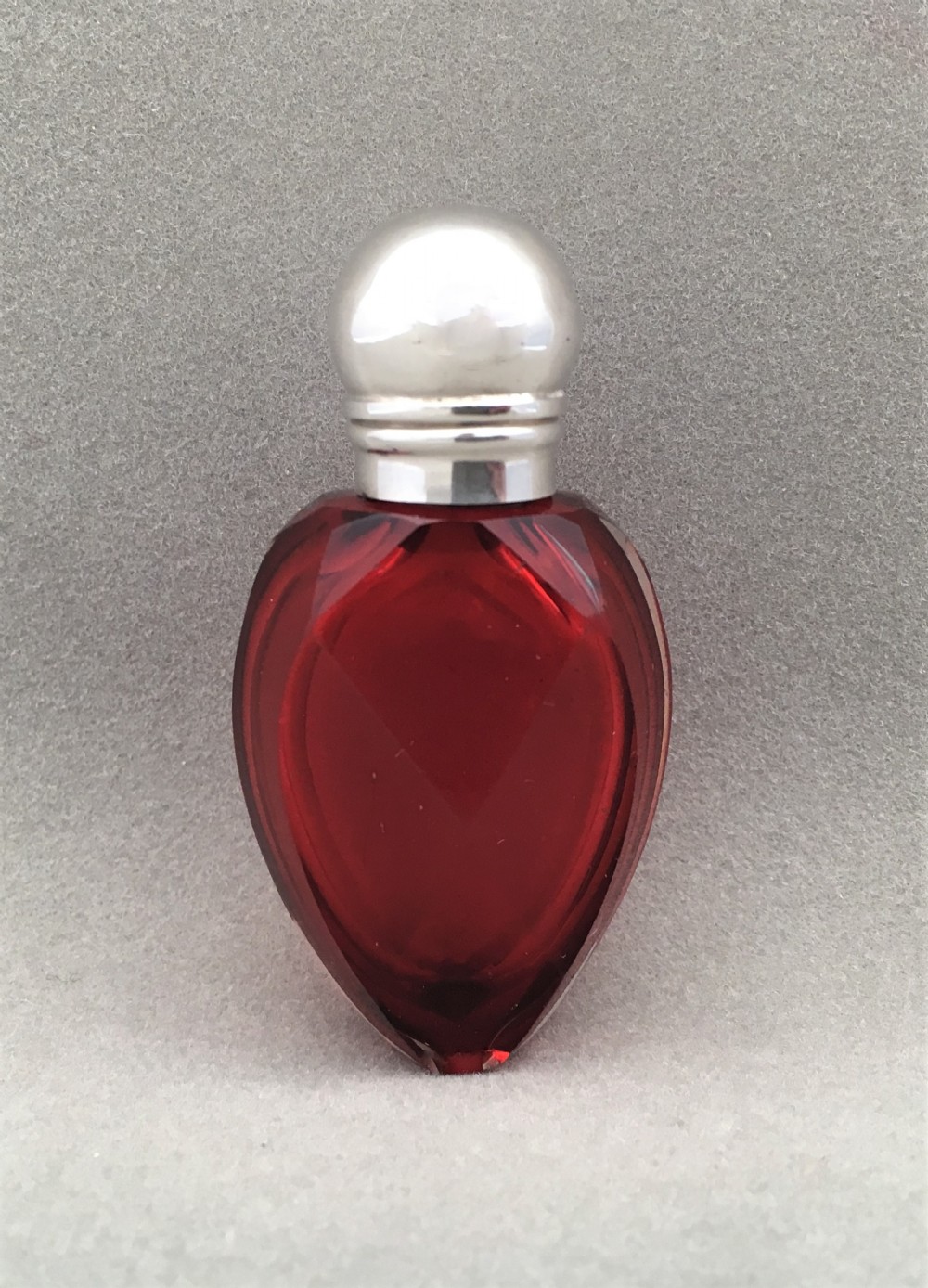 An unusual Victorian silver & cranberry scent bottle.