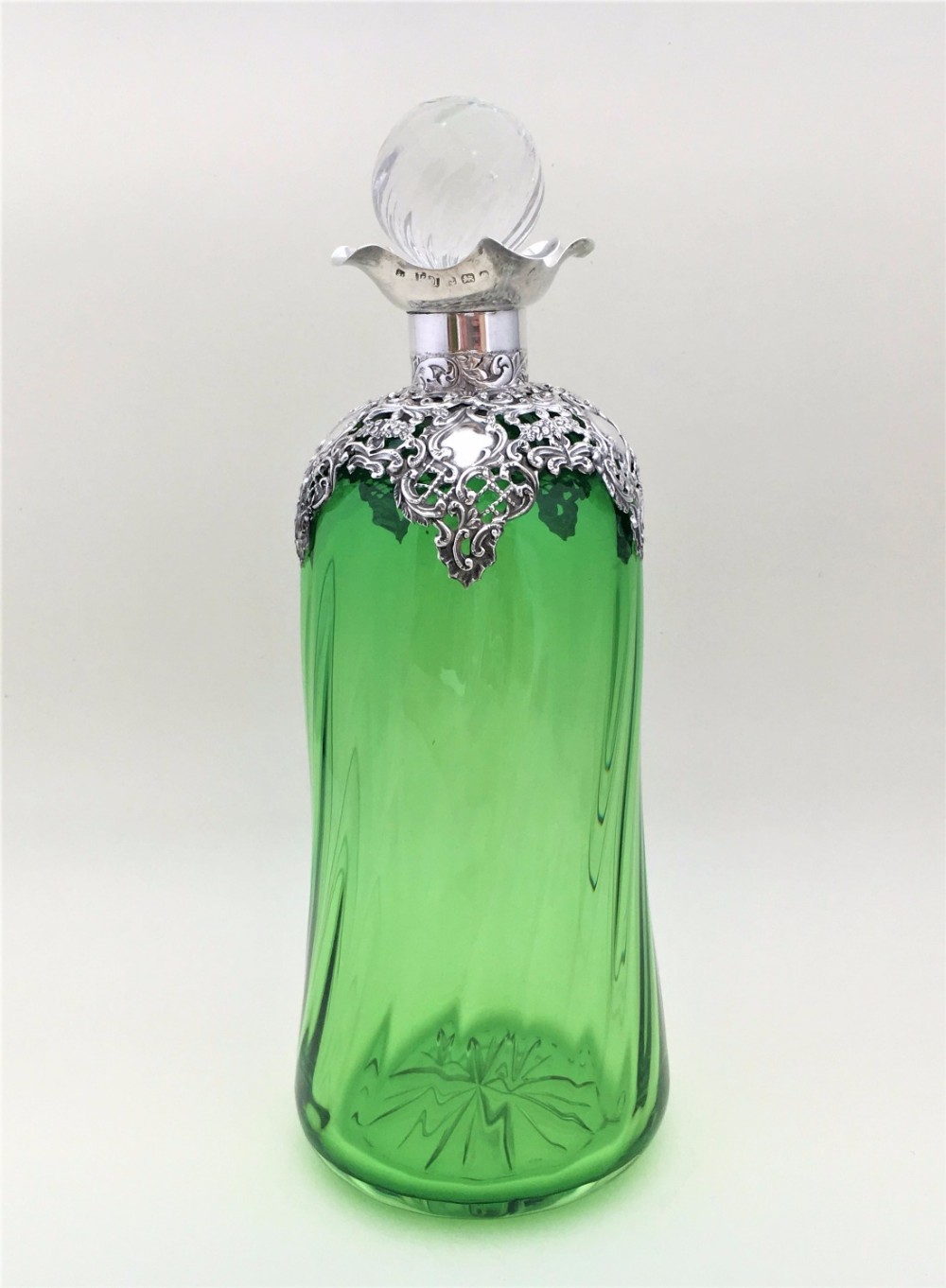 A magnificent Edwardian Silver mounted decanter.