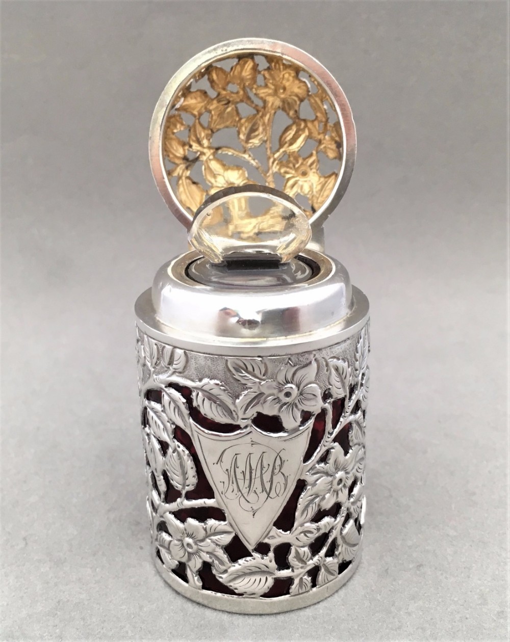 A stunning Victorian Silver cased Cologne bottle.