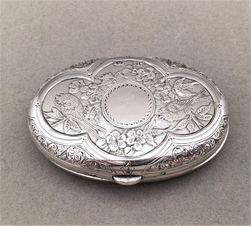A Sampson Mordan Silver travelling photo frame.