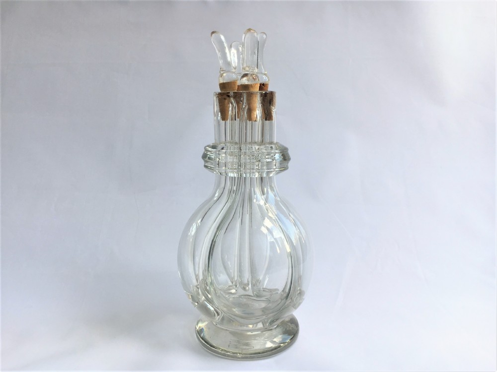 A small glass four part liqueur 'butler's' decanter.