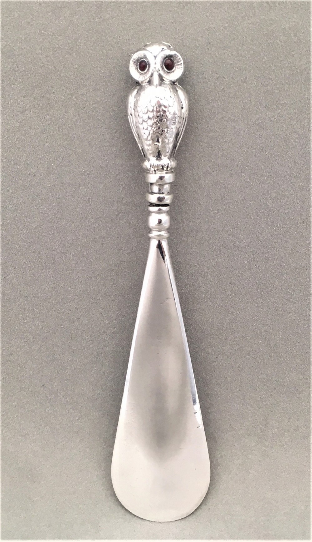 A fabulous hallmarked silver owl shoe horn.