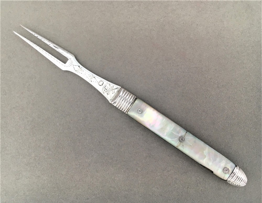 An Exquisite 18th Century Silver bright cut fruit fork.
