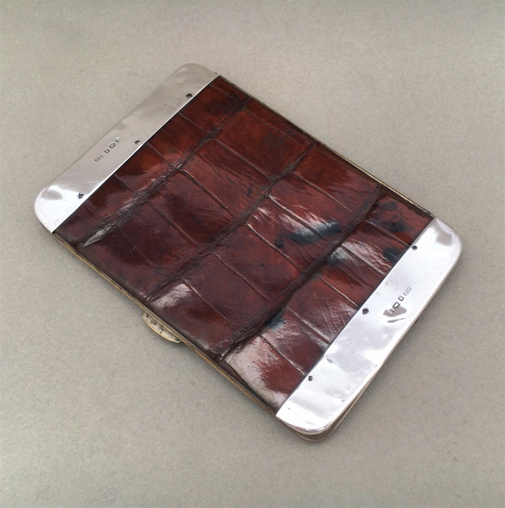 A Charming Edwardian silver mounted wallet.