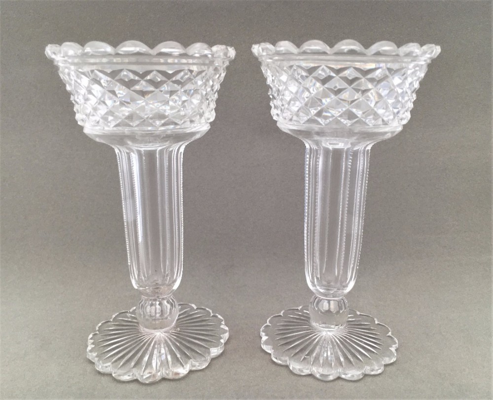 An exquisite pair of Edwardian cut glass hyacinth vases.