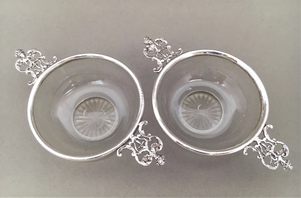 A pair of silver mounted Victorian trinket dishes.