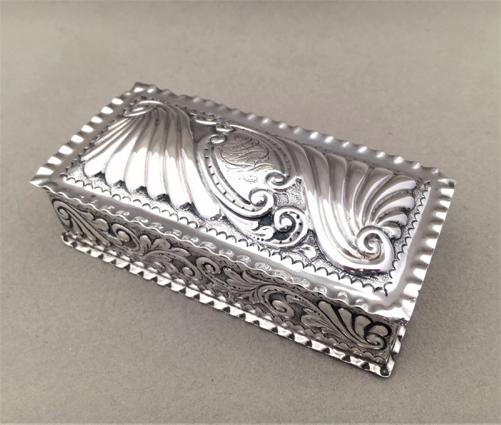 A Victorian repoussé silver trinket box.