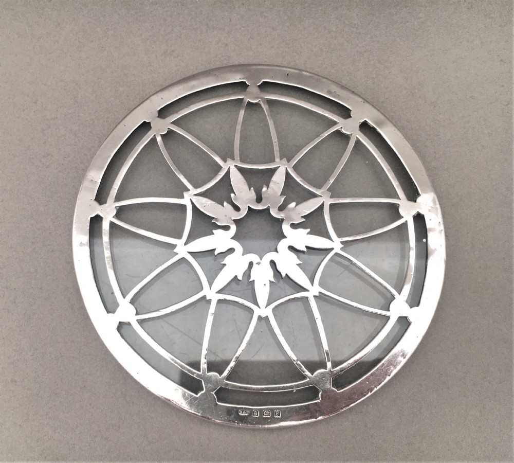 An attractive silver teapot stand or coaster. View II