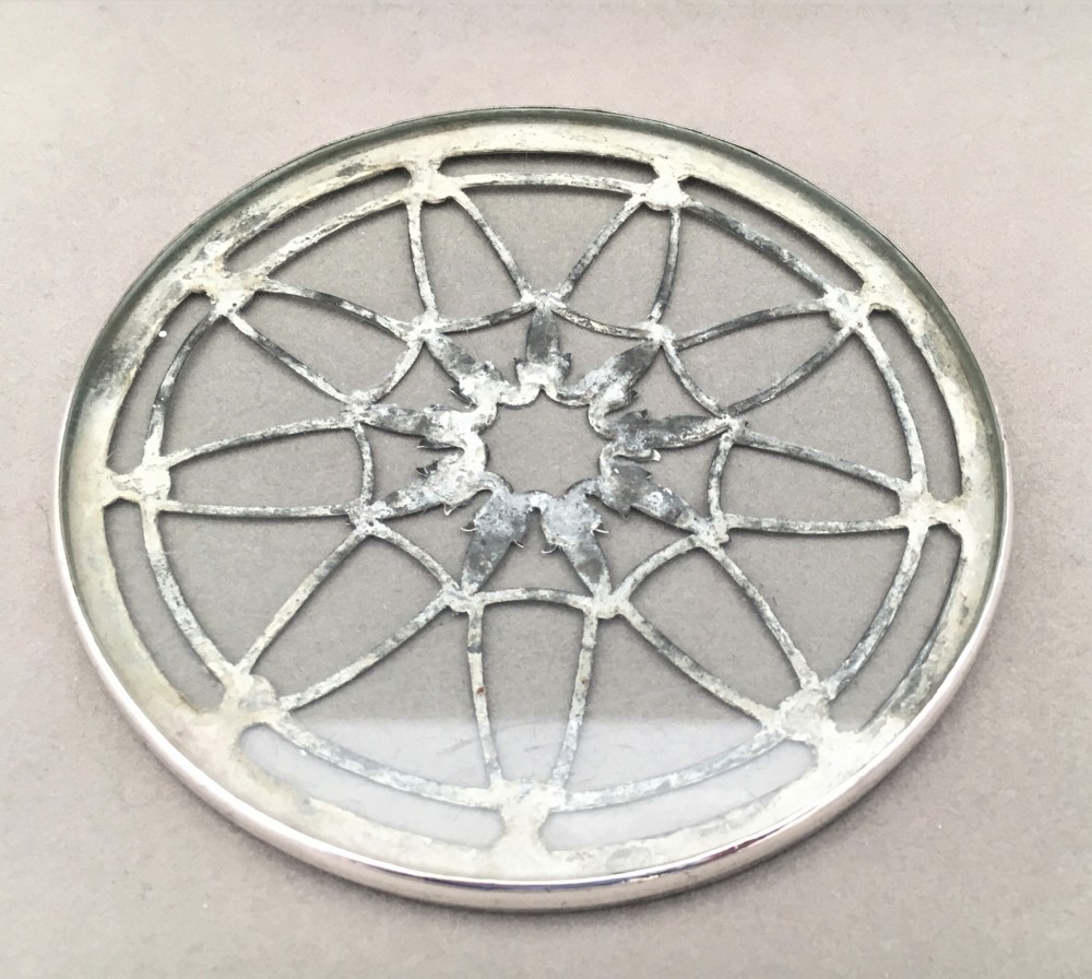An attractive silver teapot stand or coaster. View III