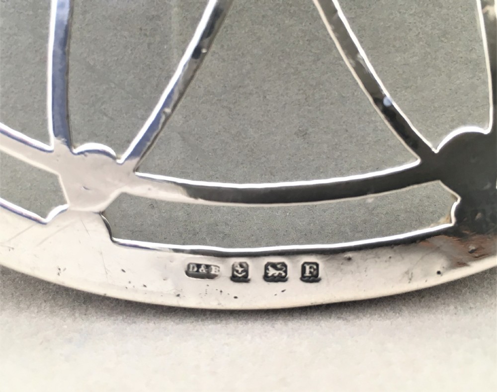 An attractive silver teapot stand or coaster. View IV