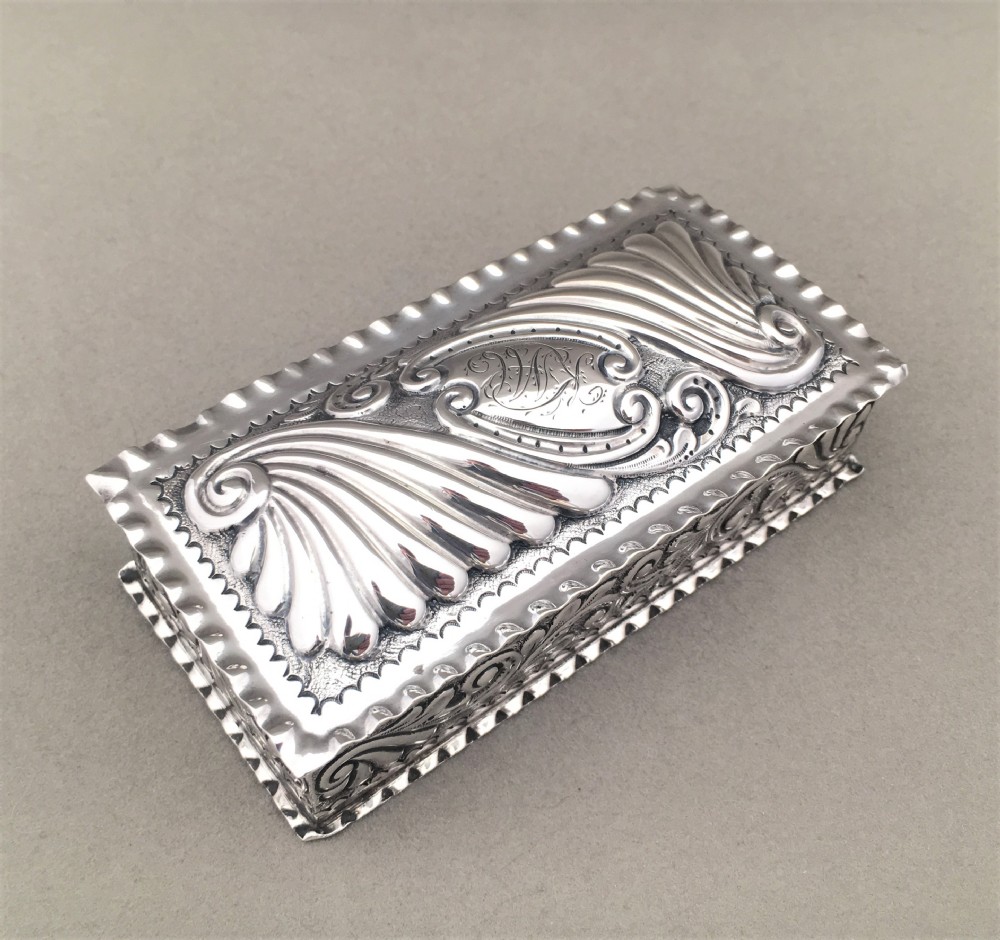 A Victorian repoussé silver trinket box. View II