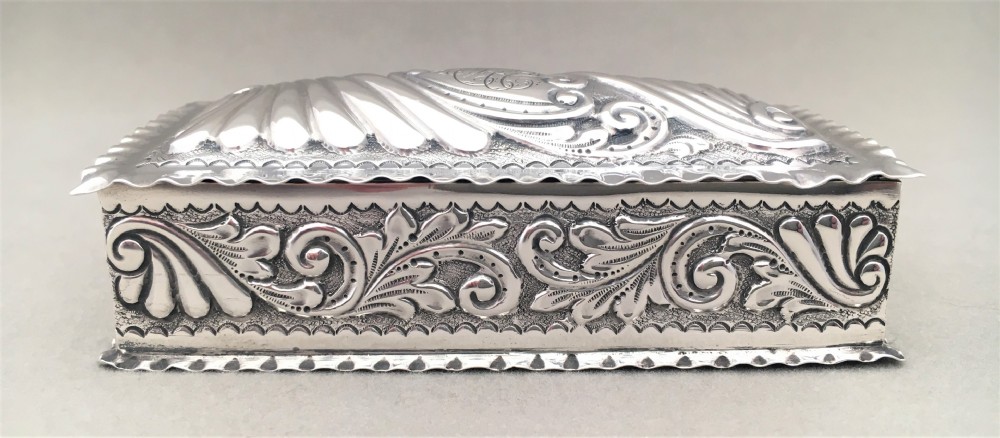 A Victorian repoussé silver trinket box. View IV