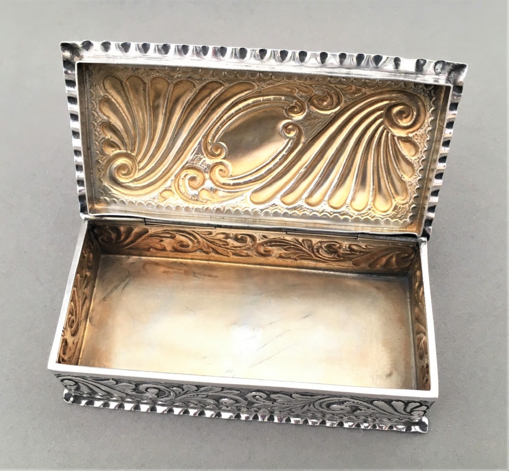 A Victorian repoussé silver trinket box. View V