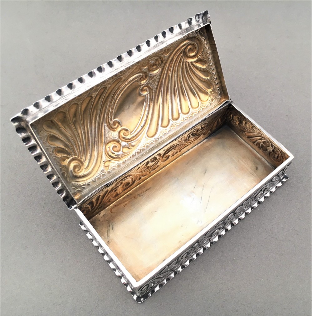A Victorian repoussé silver trinket box. View VI