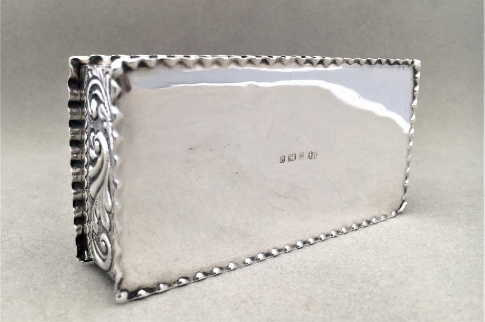 A Victorian repoussé silver trinket box. View VII